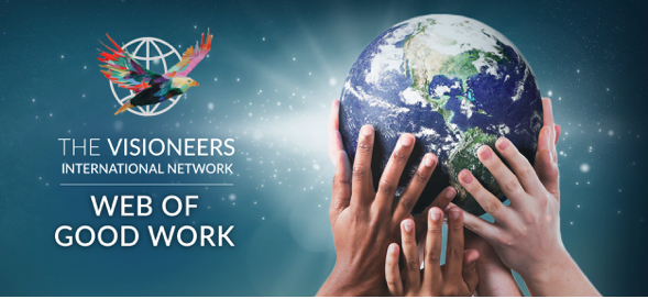 Visioneers International Network Web of Good Work with a globe supported by a collection of diverse hands symbolizing global support, collaboration and unity on a backdrop of stars.